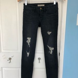 Dark wash distressed skinny jeans